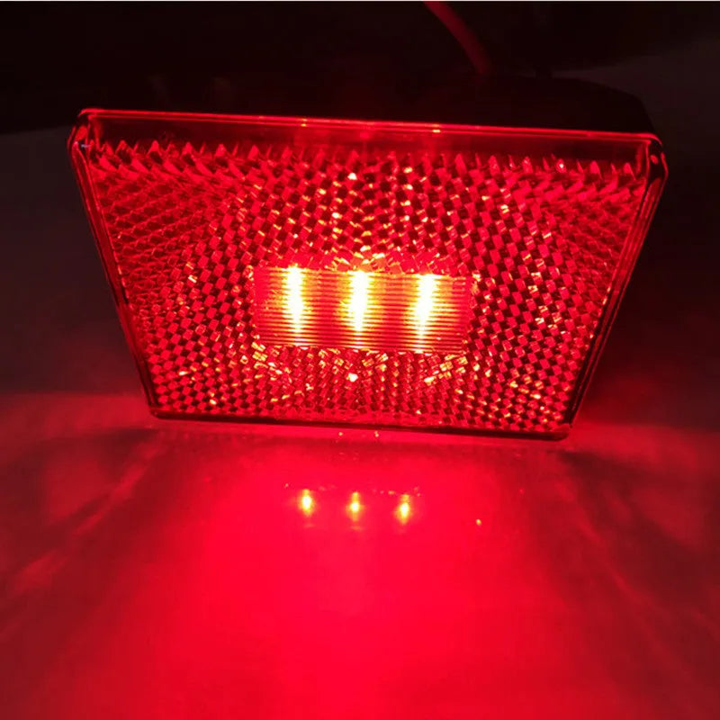 Red LED trailer side marker clearance lamp with 19cm wire on white background.
