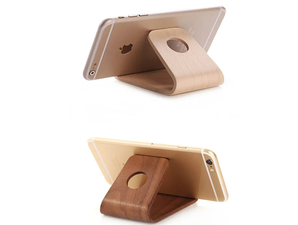Walnut wooden iPhone stand with lazy bracket design on wooden desk