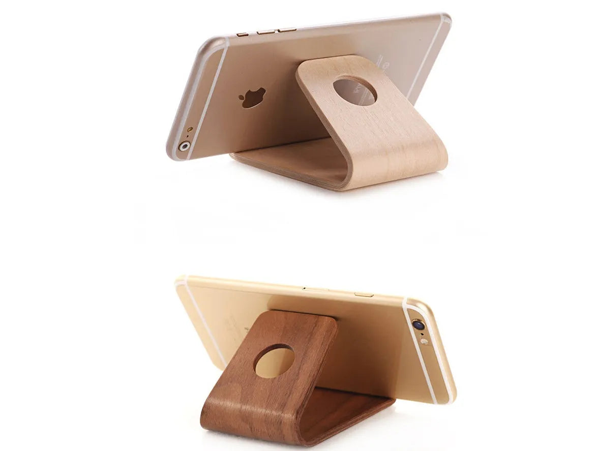 Walnut wooden iPhone stand with lazy bracket design on wooden desk