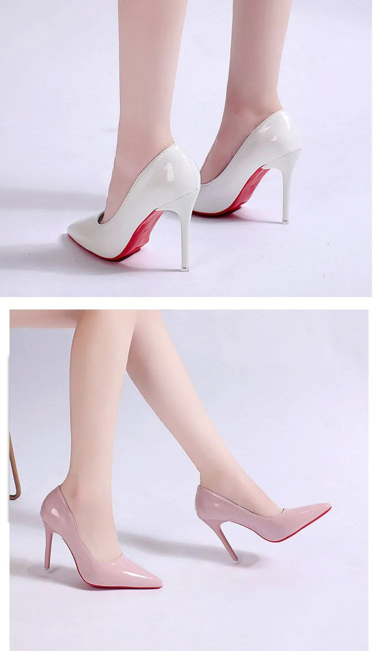 Women's black pointed toe stiletto heel pumps with a shallow mouth design on a plain background.
