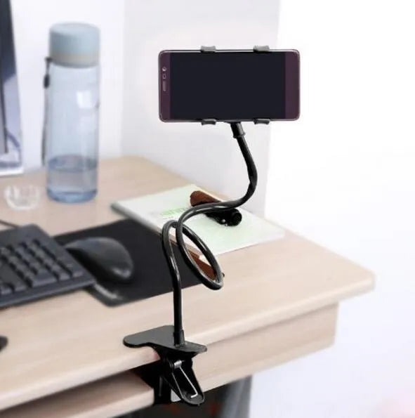 Black portable phone holder with long flexible arm and V-clip on a bedside table