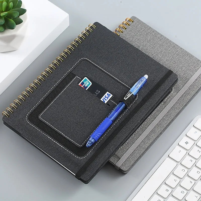 A5 spiral bound reusable notebook with stone paper, shown with pen on customisable coloured cover.