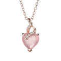 Rose gold cross chain necklace with a pink heart-shaped synthetic crystal pendant.