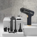 Black wireless handheld car vacuum cleaner with nozzle attachments and USB cable