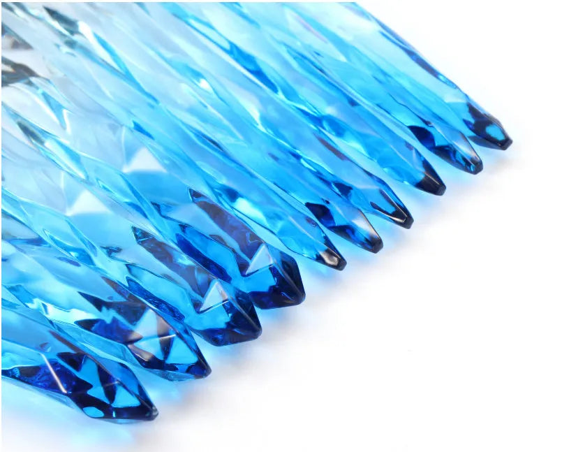 Ten crystal-handled foundation brushes with artificial fibre bristles in black, blue, red, and yellow.