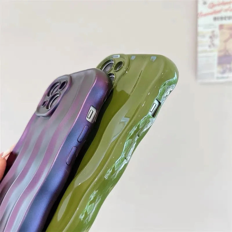 Silicone iPhone case with water ripple texture in green, shown on an iPhone 17 model