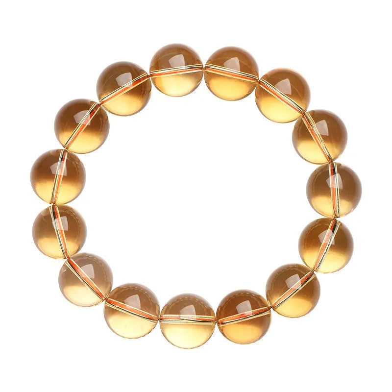 Natural citrine scattered beads ball bracelet showing polished stones in yellow-amber hues on a white background.