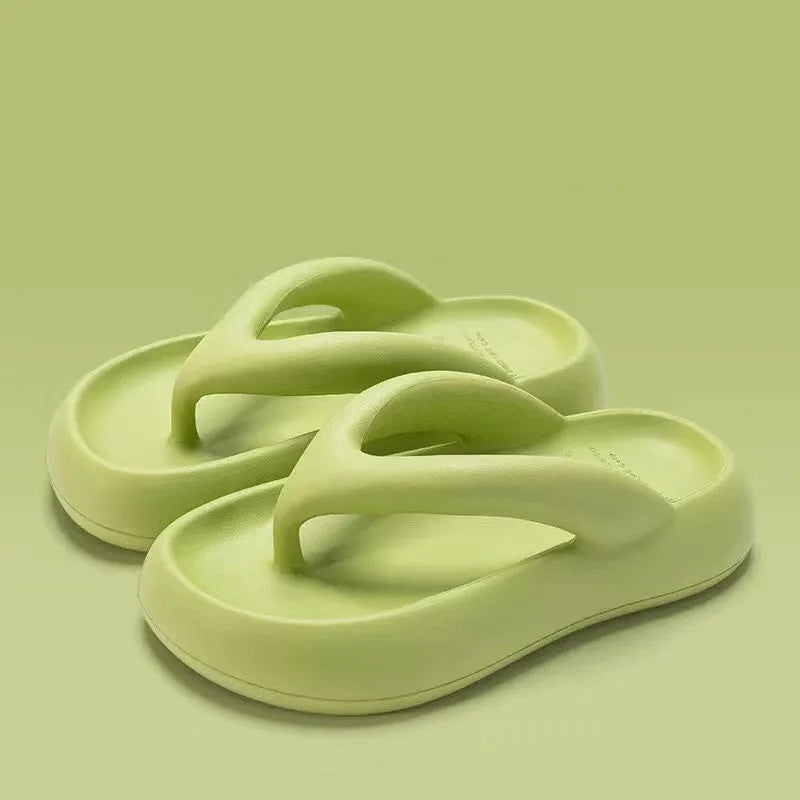 Solid colour women's flip-flops with a thick sole, decorative bow, and thong strap.