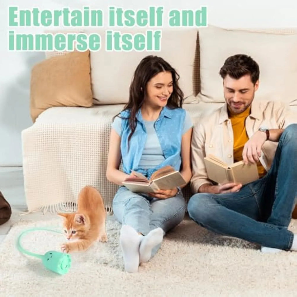 Automatic electronic cat wand toy with swinging silicone tail on a green background