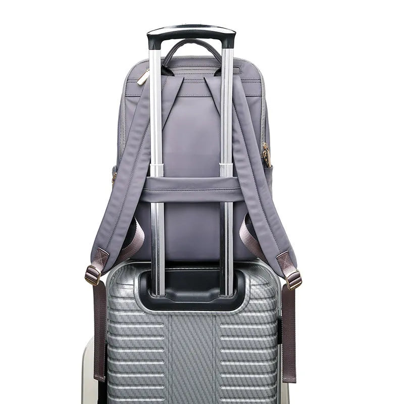 Oxford cloth women's backpack in black or purplish grey with large capacity and anti-theft features