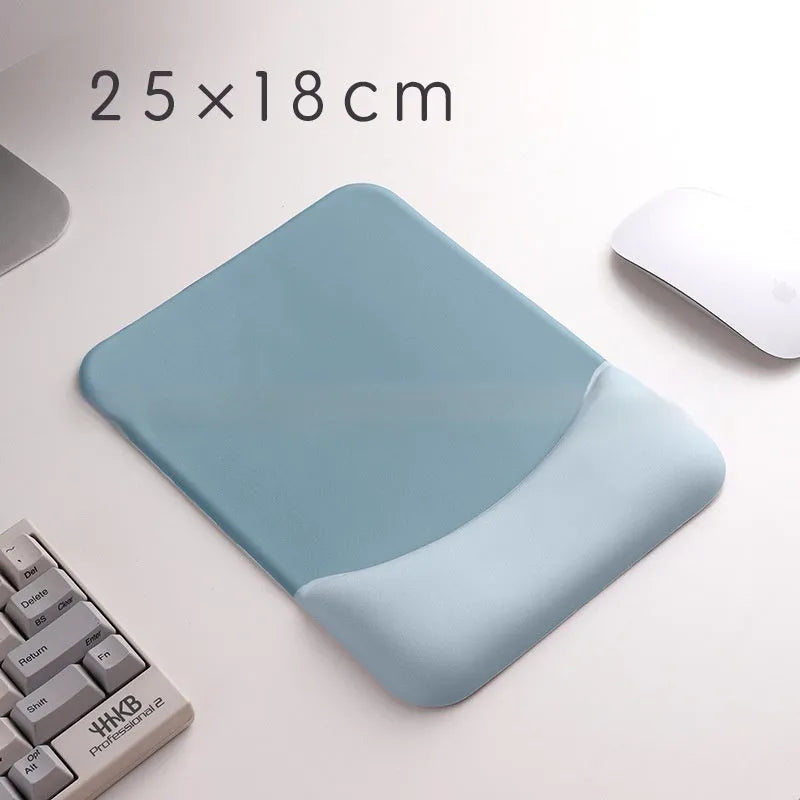Square black silica gel wrist rest mouse pad on a desk with keyboard