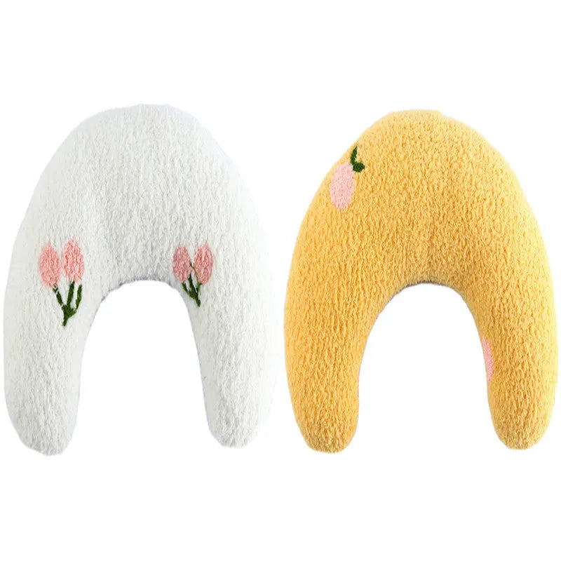 Small blue U-shaped plush pillow for cats or small dogs on a white background.