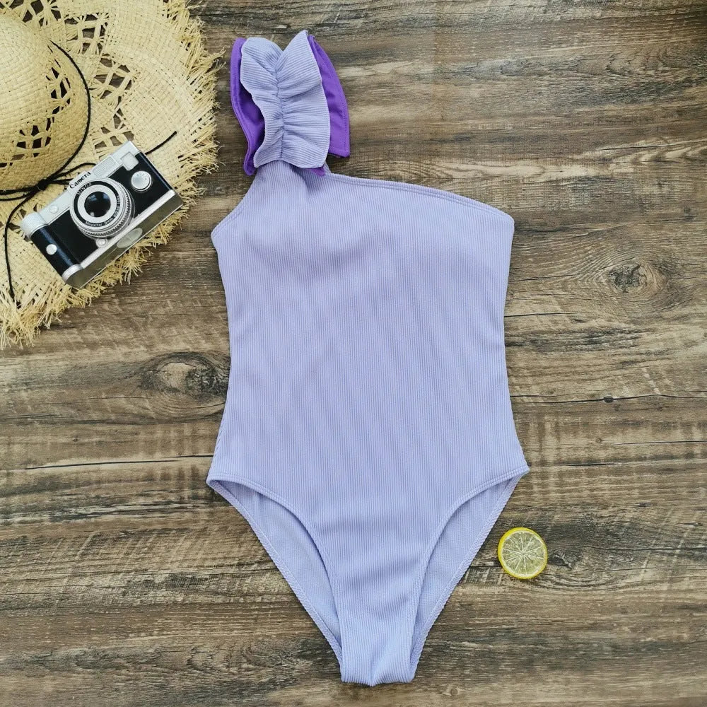Women's single-shoulder suspender one-piece swimsuit with high waist design in solid colour