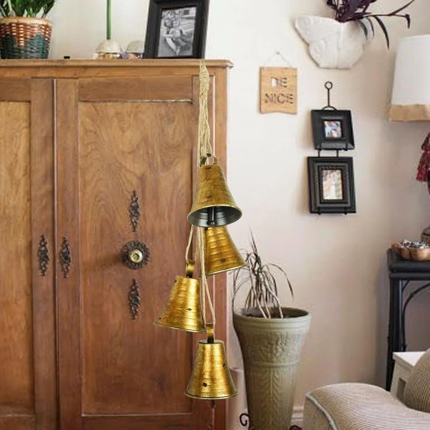 Set of four retro country handmade metal bells in rustic style, each 11.5 x 8.5 cm, on white background