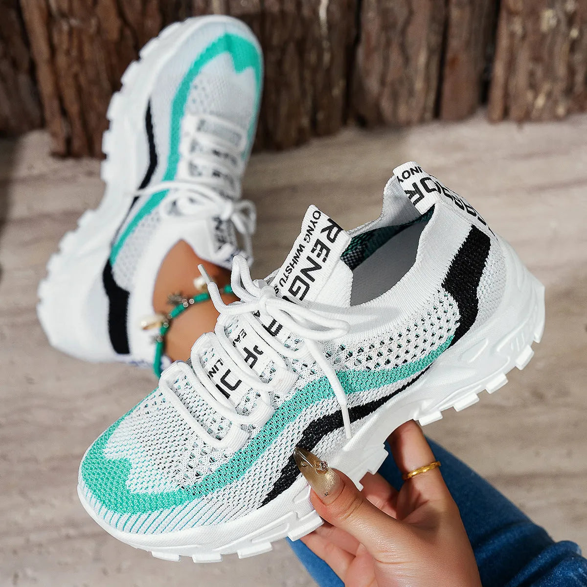 Lightweight women's casual shoes with mesh upper and soft PVC sole in black and white
