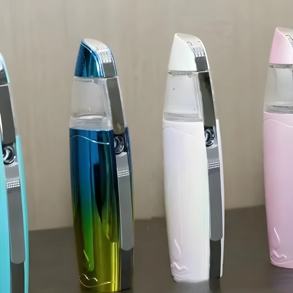 Peacock blue USB rechargeable handheld facial steamer producing moisturising hydrogen-rich water vapour