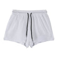 Man wearing black quick-dry nylon summer shorts, showing mid-waist sports leisure style.