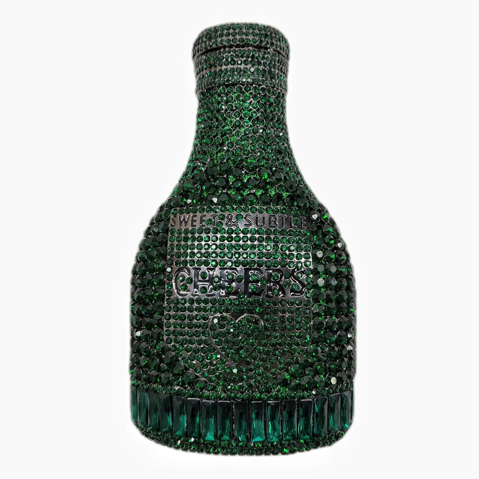 Gold hard-shell champagne bottle shaped evening clutch with rhinestones on a table.