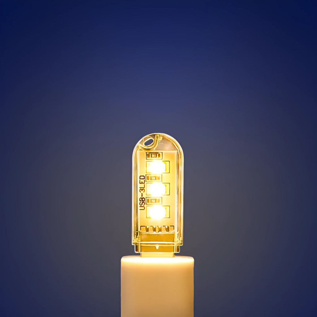 Small white LED baby night light with USB cable, measuring 6cm by 1.8cm