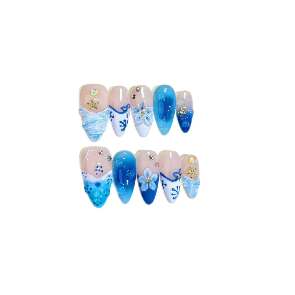 Blue hand-painted carved summer ice transparent plastic fake nails set in sizes XS, S, M, L.