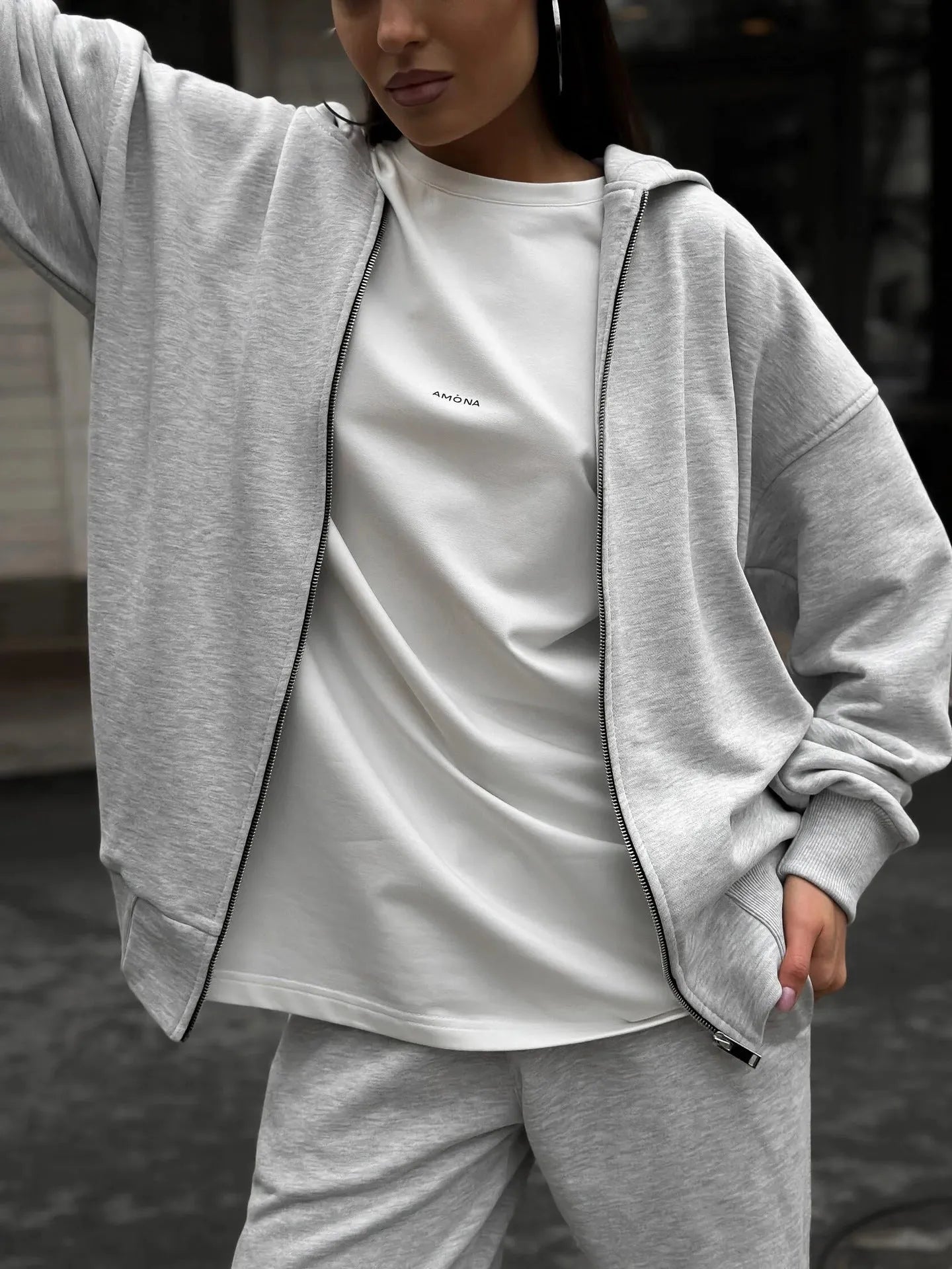 Street style loose-fit two-piece set with long-sleeved coat and trousers in grey.