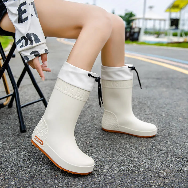 Women's PVC rain boots in solid colours with non-slip soles and waterproof mouth design