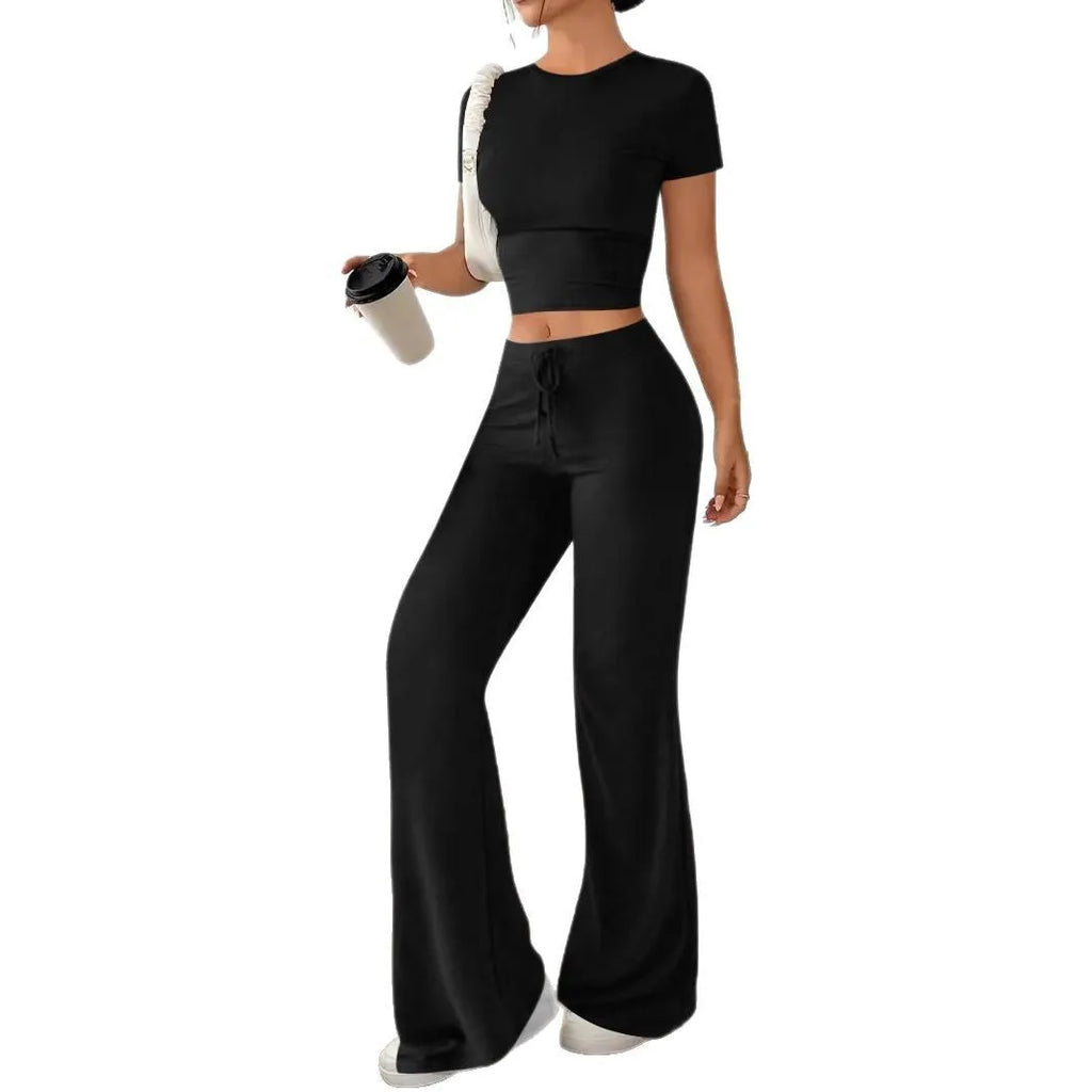 Women's black high waist trousers and short sleeve T-shirt suit set on a hanger