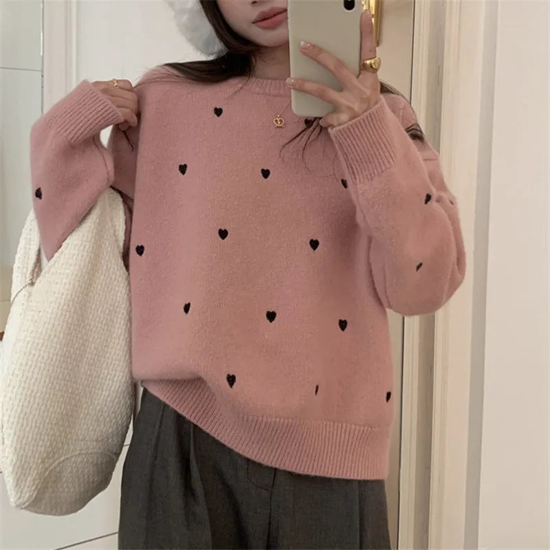 Women's loose fit cream pullover sweater with love heart embroidery detail on the front
