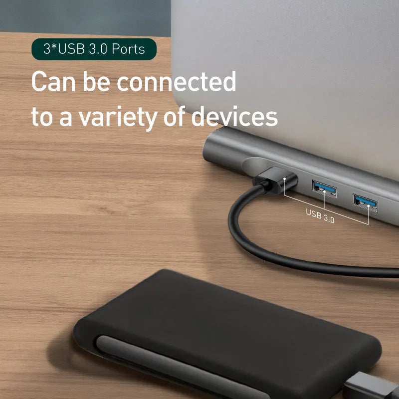 Grey ten-port laptop docking station with integrated cooling bracket showing HDMI, VGA, USB, and Ethernet ports