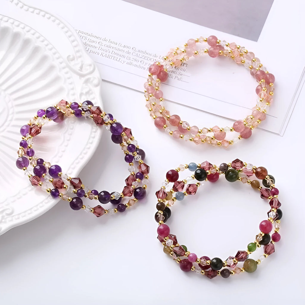 Women's adjustable three-ring crystal bracelet with colourful gemstones on wrist
