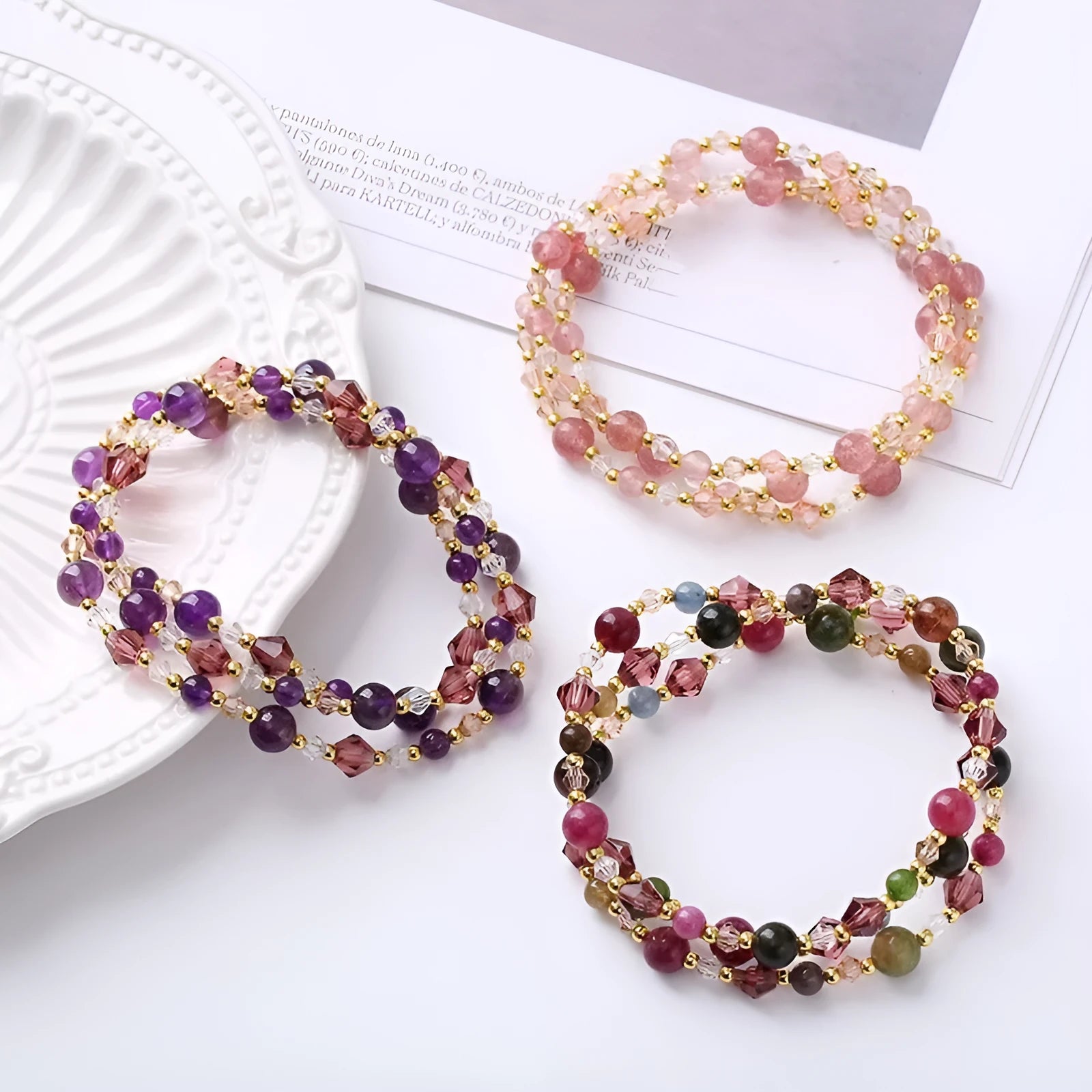 Women's adjustable three-ring crystal bracelet with colourful gemstones on wrist