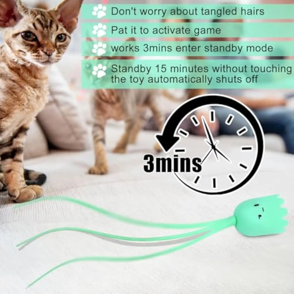 Automatic electronic cat wand toy with swinging silicone tail on a green background