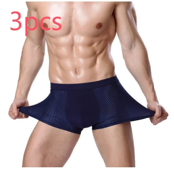 Men's solid colour modal boxer briefs with U convex design on a mannequin, showing mid-waist fit.