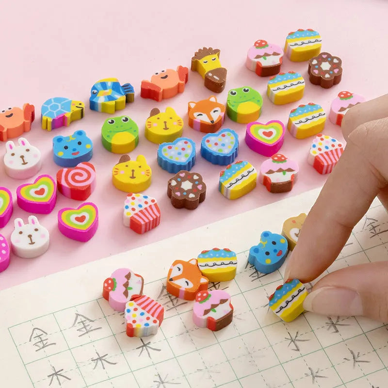 50 small colourful cartoon erasers in a pearlescent bag showing fruit, animal, cake, and Halloween themes.