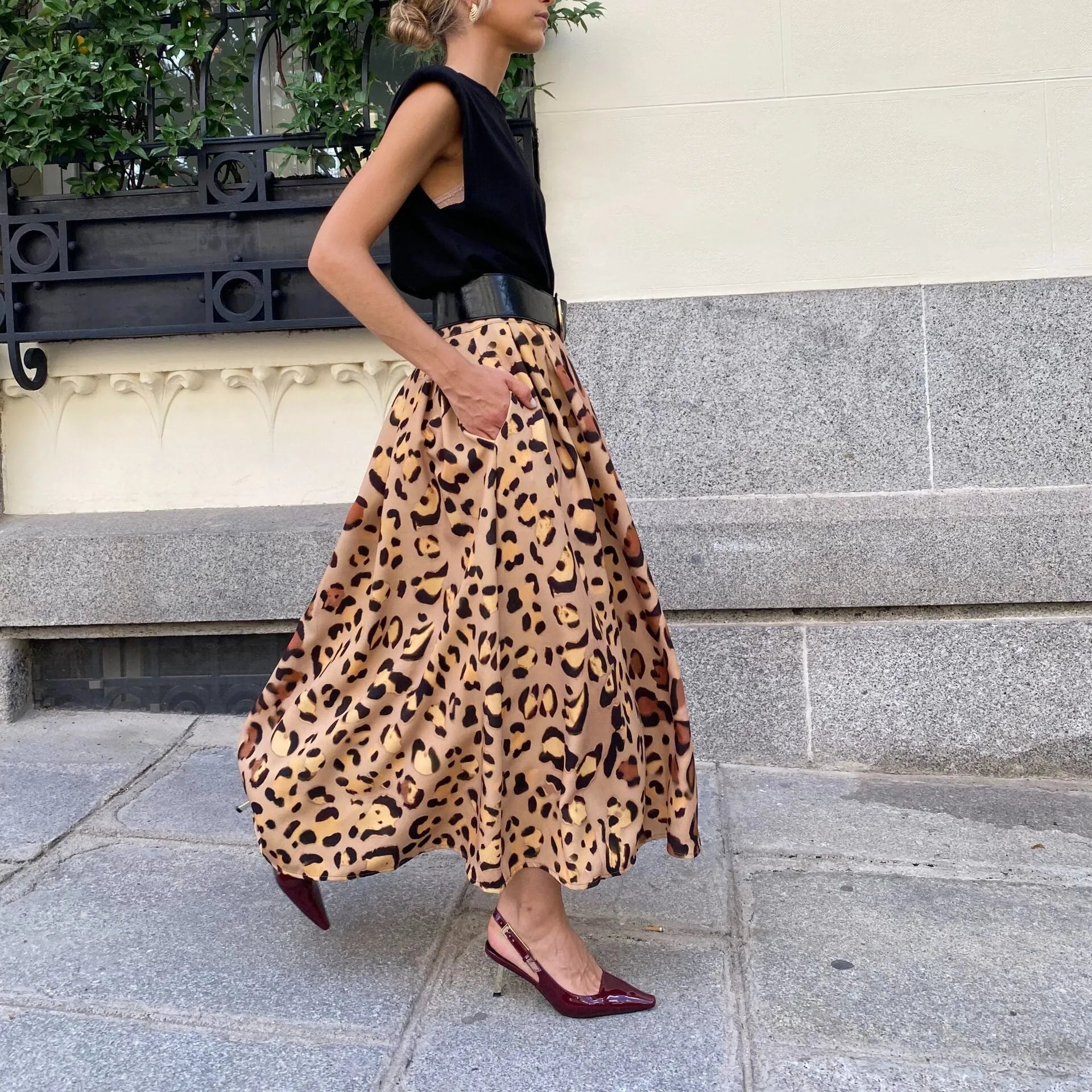 Brown leopard print women's long A-line skirt with a big hem.