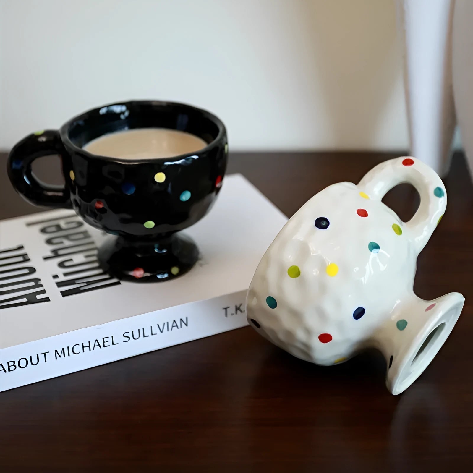 Hand-pinched irregular shaped ceramic mug in a solid colour, shown from the side.