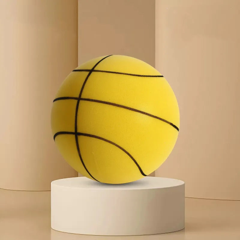 Silent high density foam sports ball in assorted bright colours next to a basketball frame.