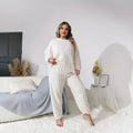 Women's milky white polyester two-piece lounge suit with crew neck top and trousers