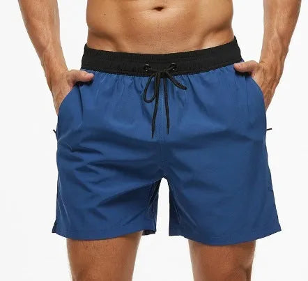 Men's blue drawstring shorts with a zippered pocket and stitching waist detail