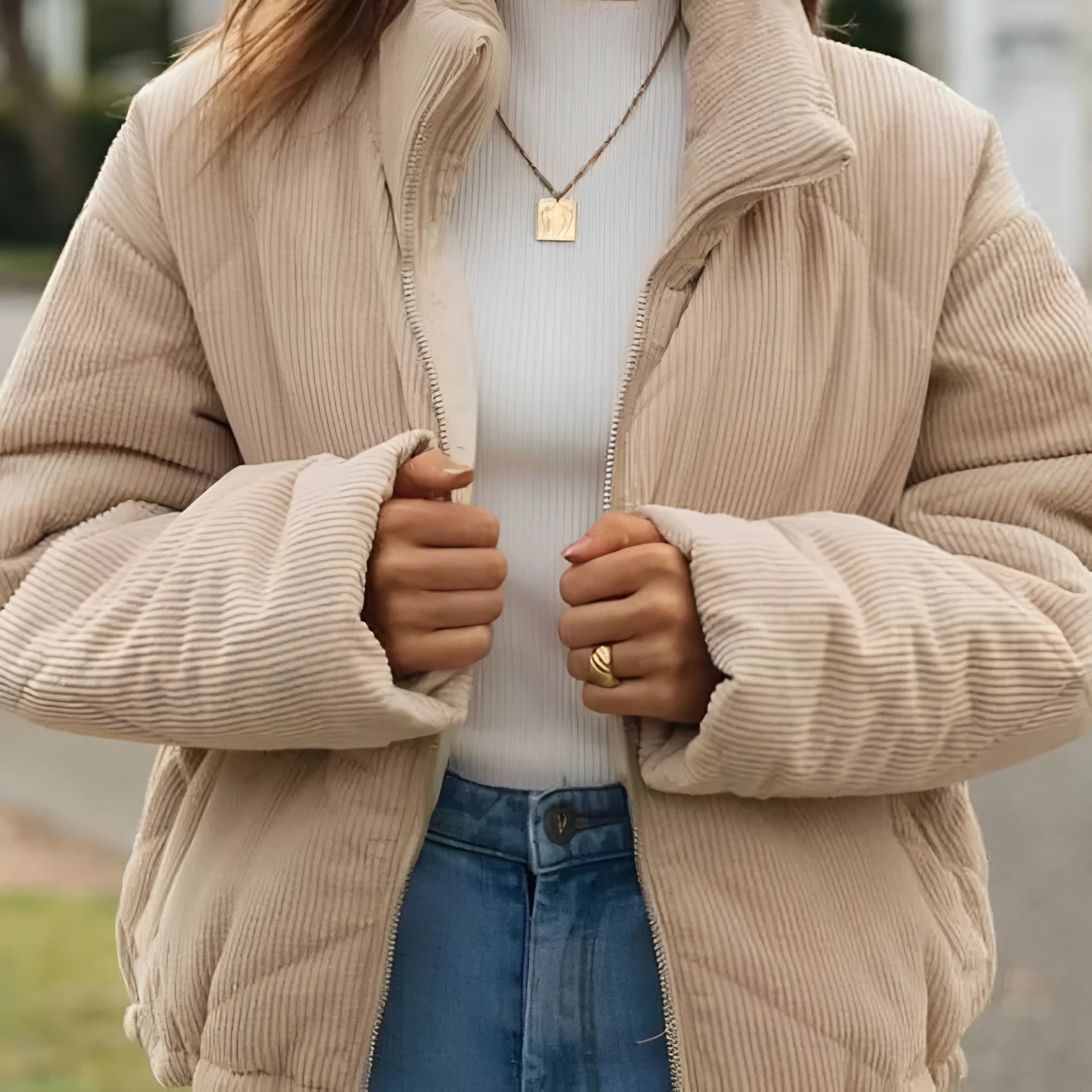 Women's apricot-coloured corduroy jacket with a stand collar, long sleeves, and a front zip.
