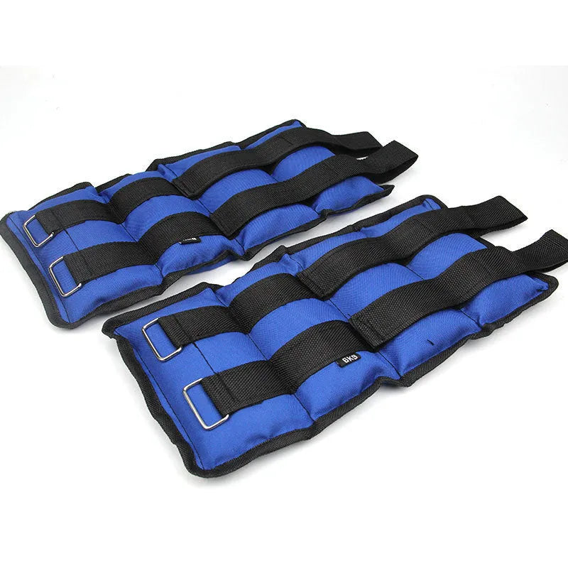 Pair of Oxford cloth legging sandbag weights for athletic training, shown with ankle strap.