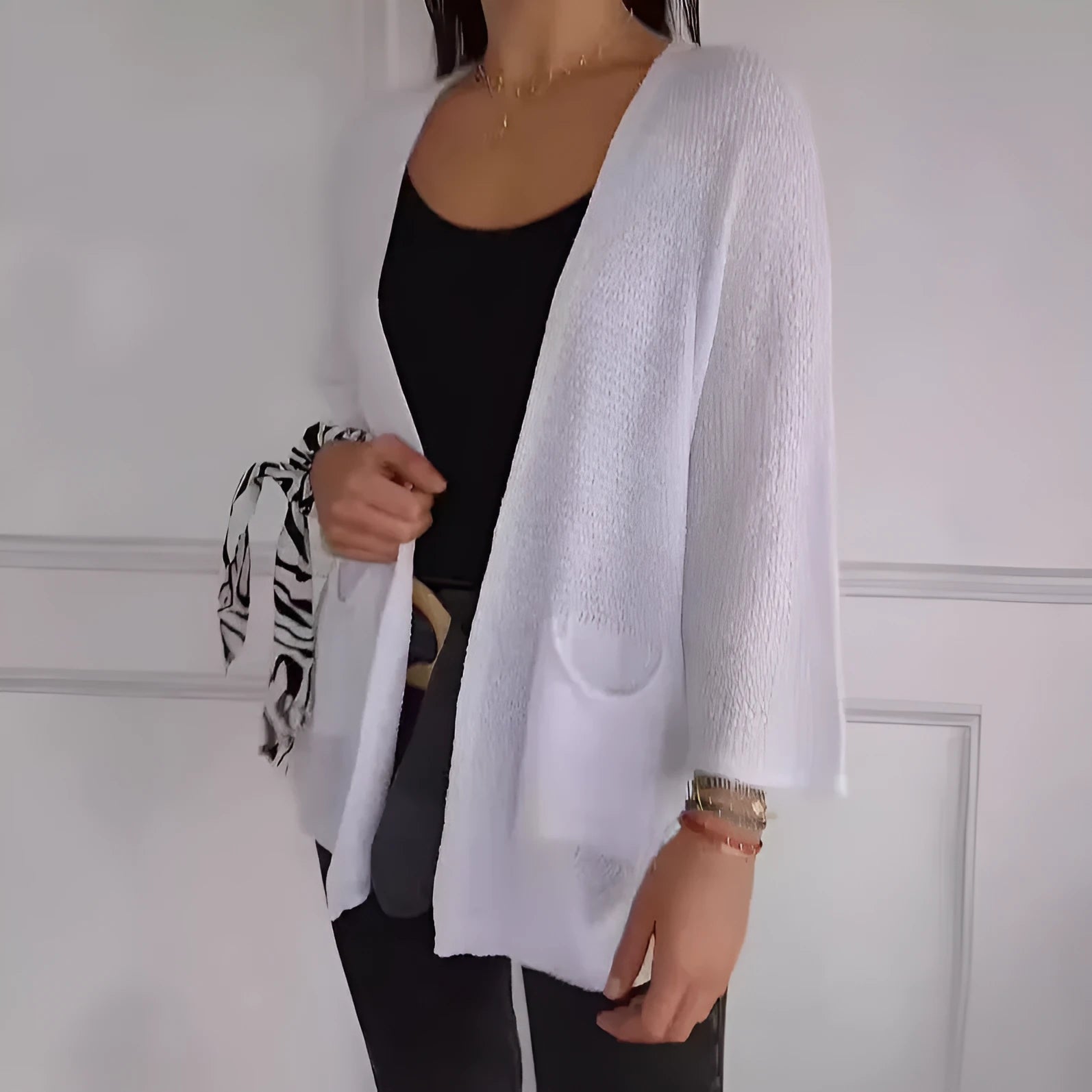 Women's thin waffle weave cardigan coat in army green with pockets, shown on a hanger.