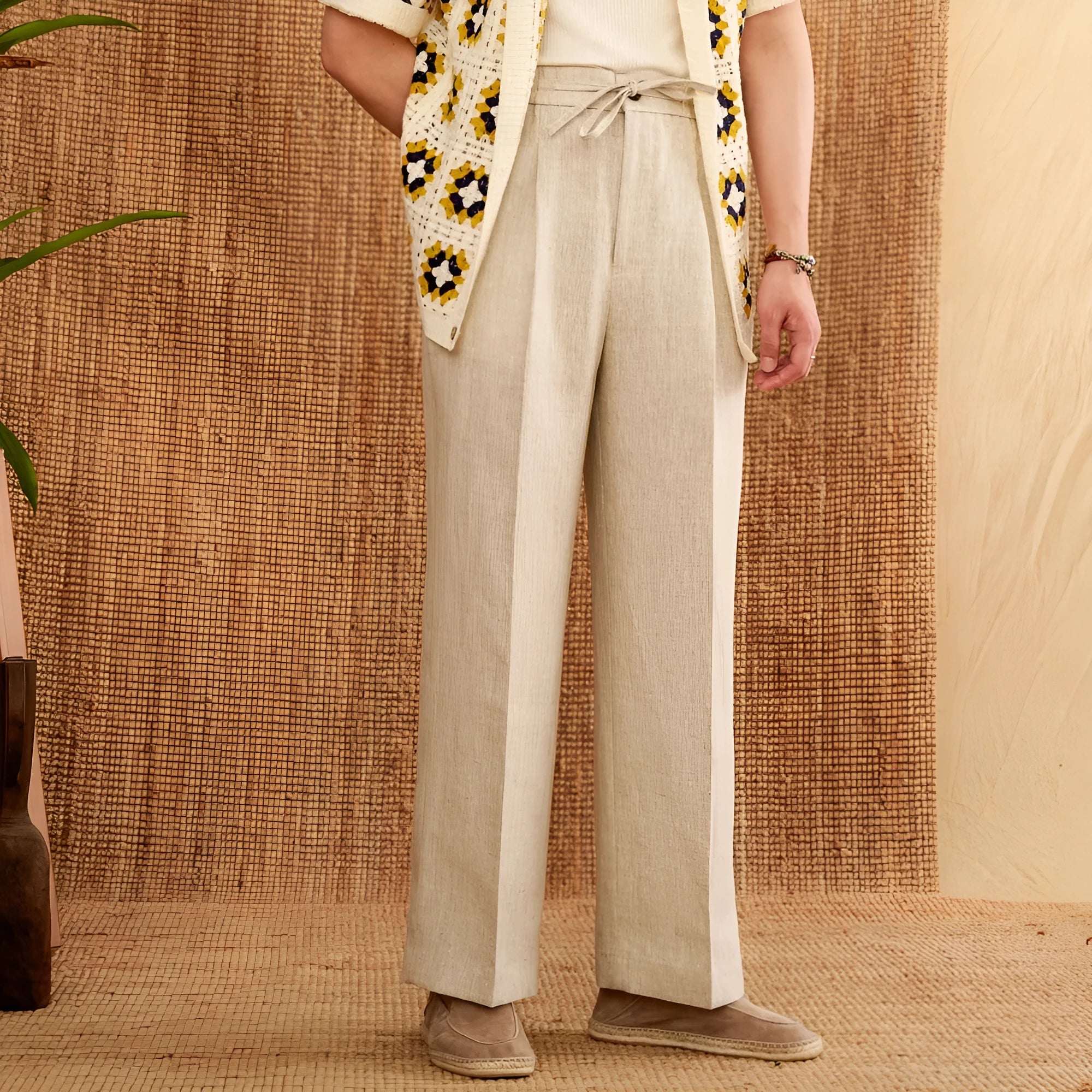 Straight-leg linen trousers with elasticated high waistband in navy blue, white, and greige colours