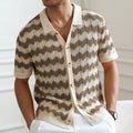 Blue hollow jacquard corrugated short sleeve sweater on a hanger, showing textured weave detail.
