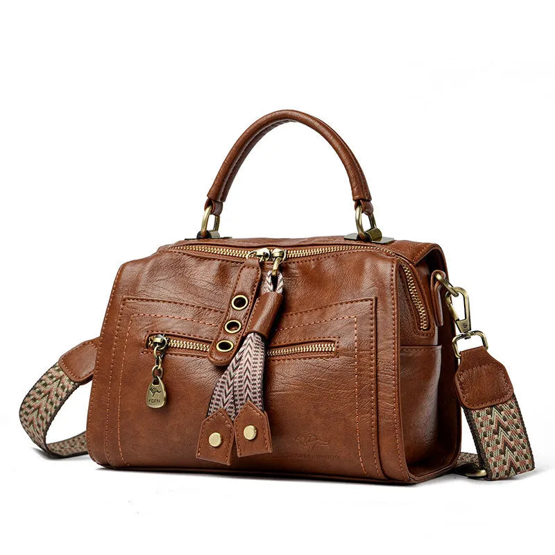 Women's grey PU leather one-shoulder crossbody bag with a square shape and outer pocket