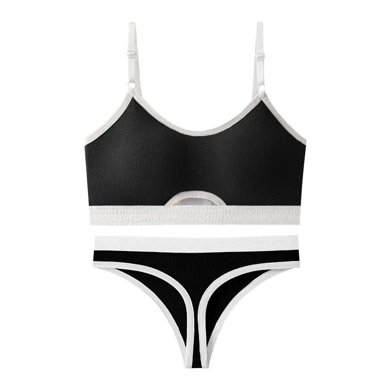 White sports underwear vest with contrast back detail and matching underwear, shown on a hanger.