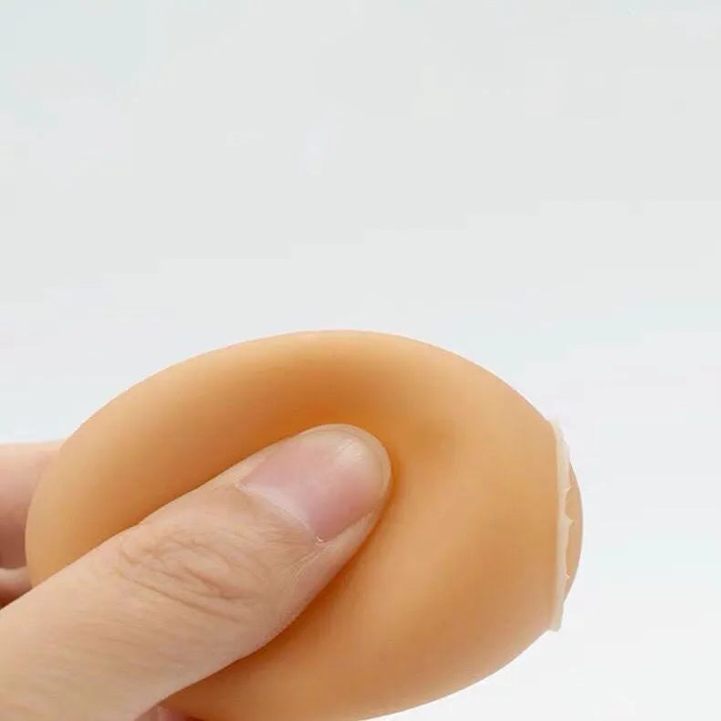 Egg-shaped plastic dog toy with squeaker for teeth cleaning and interactive play