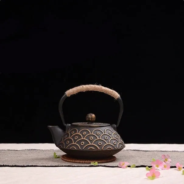 A cast iron teapot with Japanese-style hand-painted decoration, shown in a Bronze finish, with a capacity of 0.9 litres.