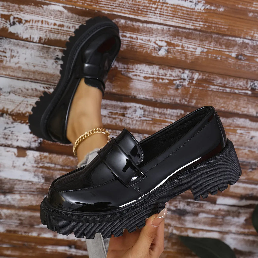 Plus size women's slip-on loafers with a chunky platform heel in black, green, and wine red colours.