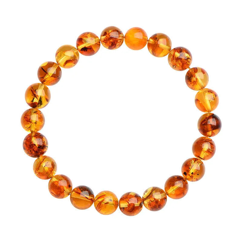 Natural yellow piebald amber bracelet with geometric design and polished Baltic amber beads